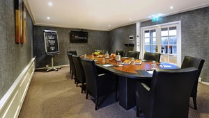 Boardroom with plasma screen and flip chart